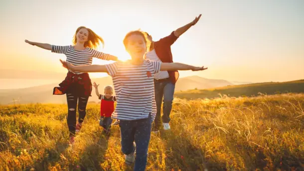 pcs image4 children running through a field pretending to be planes
